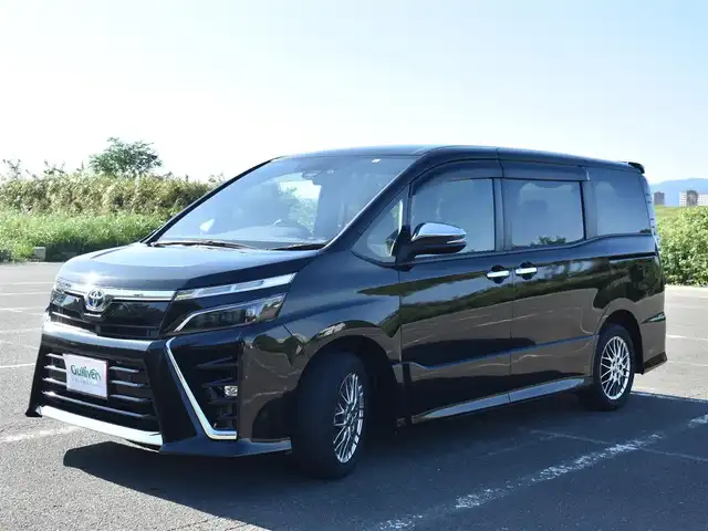トヨタ ヴォクシー ハイブリッド ZS 煌Ⅲ 福岡県 2021(令3)年 4.6万km イナズマスパーキングブラックガラスフレーク トヨタセーフティセンス/純正9インチメモリーナビ/純正後席フリップダウンモニター/フルセグTV/CD/DVD/BT/バックカメラ/純正前後ドライブレコーダー/純正LEDヘッドライト/純正16インチアルミホイール/両側パワースライドドア/クルーズコントロール/ハーフレザーシート/前席シートヒーター/クリアランスソナー/ビルトインETC/プッシュスタート/スマートキー×2/新車時保証所/取扱説明書