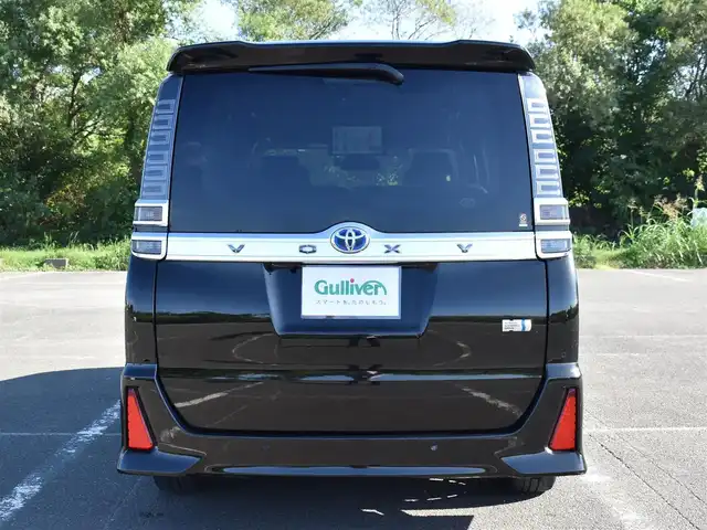 トヨタ ヴォクシー ハイブリッド ZS 煌Ⅲ 福岡県 2021(令3)年 4.6万km イナズマスパーキングブラックガラスフレーク トヨタセーフティセンス/純正9インチメモリーナビ/純正後席フリップダウンモニター/フルセグTV/CD/DVD/BT/バックカメラ/純正前後ドライブレコーダー/純正LEDヘッドライト/純正16インチアルミホイール/両側パワースライドドア/クルーズコントロール/ハーフレザーシート/前席シートヒーター/クリアランスソナー/ビルトインETC/プッシュスタート/スマートキー×2/新車時保証所/取扱説明書