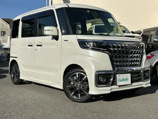 スズキ スペーシア カスタム HYBRID XS 和歌山県 2022(令4)年 0.5万km ピュアホワイトP Panasonic8インチメモリーナビ（フルセグTV/FM/AM/SD/USB/iPod/USB/Bluetooth/MEMORYMUSIC）/バックカメラ/ETC/両側パワースライドドア/アイドリングストップ/クルーズコントロール/オートライト/横滑り防止装置/ベンチシート/衝突被害軽減ブレーキ/HUD/シートヒーター/純正アルミホイール/純正ドアバイザー/純正フロアマット/取扱説明書/保証書
