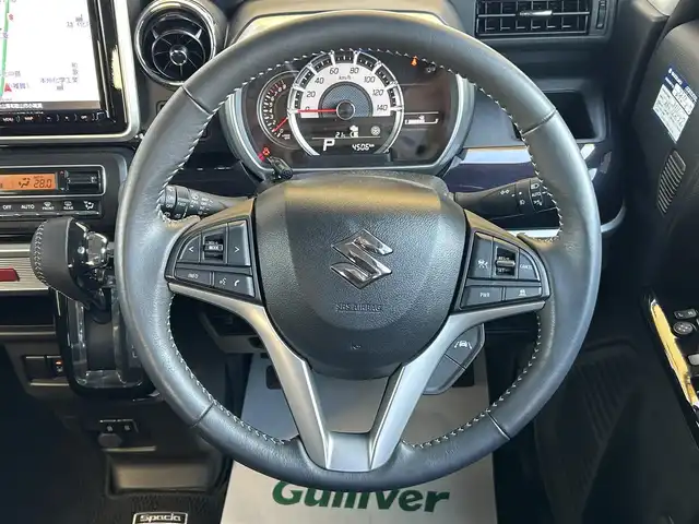 スズキ スペーシア カスタム HYBRID XS 和歌山県 2022(令4)年 0.5万km ピュアホワイトP Panasonic8インチメモリーナビ（フルセグTV/FM/AM/SD/USB/iPod/USB/Bluetooth/MEMORYMUSIC）/バックカメラ/ETC/両側パワースライドドア/アイドリングストップ/クルーズコントロール/オートライト/横滑り防止装置/ベンチシート/衝突被害軽減ブレーキ/HUD/シートヒーター/純正アルミホイール/純正ドアバイザー/純正フロアマット/取扱説明書/保証書