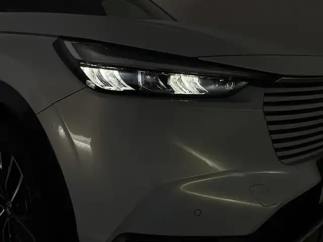 ホンダ ヴェゼル ハイブリッド e:HEV Z 群馬県 2021(令3)年 6万km プレミアムサンライトホワイトパール サイドステップガーニッシュ/置くだけ充電/パドルシフト/カーテンエアバッグ/===============/ワンオーナー/ホンダセンシング/　・衝突軽減ブレーキ/　・先行車発進お知らせ機能/　・路外逸脱抑制機能/　・標識認識機能/　・アダプティブクルーズコントロール/　・車線維持支援システム/　・トラフィックジャムアシスト/　・ブラインドスポットインフォメーション/　・誤発進抑制機能/　・後退出庫サポート/　・オートハイビーム/Honda Conected　9インチディスプレイ/　FM/AM/Bluetooth/TV/バックカメラ/前後ドライブレコーダー/ハンズフリーアクセスパワーテールゲート/ダウンヒルコントロール/前後コーナーセンサー/前席シートヒーター/純正18インチAW/純正フロアマット/スペアキー/保証書/取扱説明書