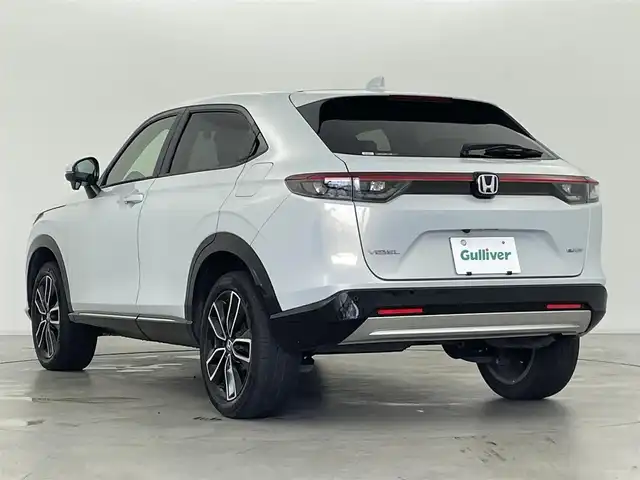 ホンダ ヴェゼル ハイブリッド e:HEV Z 群馬県 2021(令3)年 6万km プレミアムサンライトホワイトパール サイドステップガーニッシュ/置くだけ充電/パドルシフト/カーテンエアバッグ/===============/ワンオーナー/ホンダセンシング/　・衝突軽減ブレーキ/　・先行車発進お知らせ機能/　・路外逸脱抑制機能/　・標識認識機能/　・アダプティブクルーズコントロール/　・車線維持支援システム/　・トラフィックジャムアシスト/　・ブラインドスポットインフォメーション/　・誤発進抑制機能/　・後退出庫サポート/　・オートハイビーム/Honda Conected　9インチディスプレイ/　FM/AM/Bluetooth/TV/バックカメラ/前後ドライブレコーダー/ハンズフリーアクセスパワーテールゲート/ダウンヒルコントロール/前後コーナーセンサー/前席シートヒーター/純正18インチAW/純正フロアマット/スペアキー/保証書/取扱説明書
