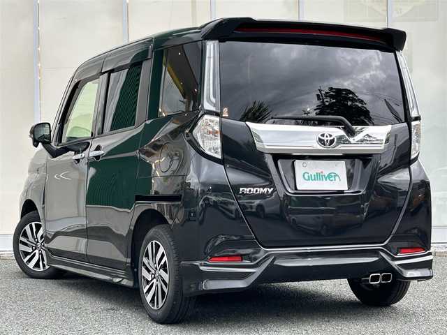 トヨタ ルーミー カスタムG 福岡県 2021(令3)年 1.7万km ブラックマイカメタリック ・純正ナビ/（TV/CD/DVD/AM/FM/SD/SDREC/Bluetooth）/・バックカメラ/・MODELISTA/・ビルドインETC/・両側パワースライドドア/・クリアランスソナー/・衝突被害軽減システム/・横滑り防止装置/・追従型クルーズコントロール/・LEDヘッドライト/・フォグランプ/・ステアリングスイッチ/・電動パーキングブレーキ/・オート電動格納ミラー/・純正ドアバイザー/・純正サンシェード/・ISOFIX