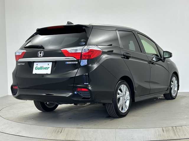 ホンダ シャトル ハイブリッド Z 奈良県 2017(平29)年 2.7万km クリスタルブラックパール 純正ギャザーズナビ/フルセグ CD DVD BT MSV AUX/バックカメラ/ビルトインETC/クルーズコントロール/車両接近通報告知/衝突軽減ブレーキ/ハーフレザーシート/シートヒーター/パドルシフト/LEDヘッドライト/オートライト/電動格納ミラー/スマートキー