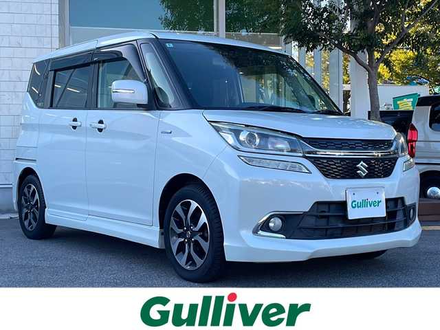 スズキ ソリオ バンディット HV MV Dカメラ ブレーキS 鳥取県 2018(平30)年 5.5万km ピュアホワイトP 登録時走行距離：54261km/4WD/ディーラー純正ケンウッド製8型メモリナビ/　CD DVD BT フルセグTV/バックカメラ/パワースライドドア/デュアルカメラブレーキサポート/クルーズコントロール/LEDヘッドライト/オートライト/フォグランプ/シートヒーター/ロールサンシェード/ISOFIX/シート下収納/革巻きステアリング/ステアリングスイッチ/プッシュスタート/スマートキー/スペアキー/新車時保証書