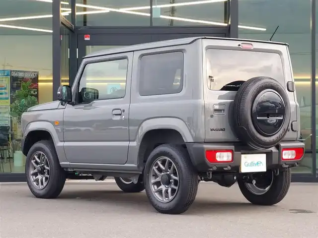 スズキ ジムニー XC 東京都 2024(令6)年 0.3万km ミディアムグレー スズキセーフティサポート/・車線逸脱警報機能/・車線逸脱抑制機能/・誤発進抑制機能/・ふらつき警報機能/・アダプティブクルーズコントロール/アイドリングストップ/LEDヘッドライト/オートライト/ダウンヒルアシストコントロール/シートヒーター/ミラーヒーター/ヘッドライトウォッシャー/16インチ純正アルミホイール