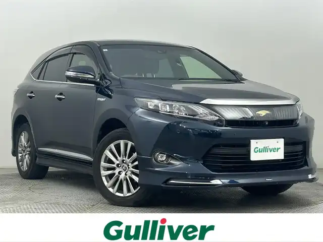 トヨタ ハリアー ハイブリッド プレミアム アドバンスドP 道央・札幌 2016(平28)年 7.7万km ブラッキッシュアゲハガラスフレーク ・４WD/・モデリスタエアロ/・MOP８インチSDナビ/　CD/DVD/USB/SD/BT/フルセグTV/・TV-Kit/・ステアリングスイッチ/・パノラミックビューモニター/・ビルトインETC/・アダプティブクルーズコントロール/・衝突軽減被害ブレーキ/・レーンキープアシスト/・クリアランスソナー/・アイドリングストップ/・横滑り防止装置/・ABS/・オートマチックハイビーム/・オートライト/・LEDヘッドライト/・フォグランプ/・パワーバックドア/・ハーフレザーシート/・D席パワーシート/・純正フロアマット/・プッシュスタート/・スマートキー/・取/保/記