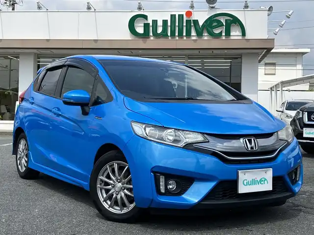 ホンダ フィット ハイブリット Sパッケージ 三重県 2014(平26)年 12万km ビビットスカイブルーP 車検R9年1月25日/♪純正インターナビ/ ・フルセグ・CD/DVD再生/ ・Bluetooth・HDMI/ ・USB/♪バックカメラ/♪シティブレーキアクティブシステム(CTBA)/♪クルーズコントロール/♪スマートキー/♪プッシュスタート/♪LEDヘッドライト/♪フォグライト/♪オートライト/♪ウィンカーミラー/♪アイドリングストップ/♪革巻ステアリング/♪ステアリングスイッチ/♪パドルシフト/♪ビルトインETC/♪フロアマット/♪ドアバイザー/♪プライバシーガラス/♪電格ミラー/♪サイド/カーテンエアバック