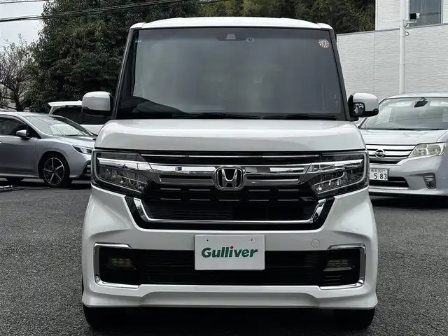 ホンダ Ｎ ＢＯＸ カスタム L ターボ 熊本県 2022(令4)年 4.1万km プラチナホワイトパール 純正８インチナビ（VXU-227NBi）/【フルセグTV/CD/DVD/Bluetooth】/バックカメラ/両側パワースライドドア/レーダークルーズコントロール/衝突被害軽減装置/レーンキープアシスト/パドルシフト/アイドリングストップ/ハーフレザーシート/シートヒーター/社外15インチAW/前後ドライブレコーダー/ビルトインETC/オートLEDヘッドライト/プッシュスタート/ステアリングスイッチ/純正フロアマット/純正ドアバイザー/横滑り防止/盗難防止装置/保証書/取扱説明書