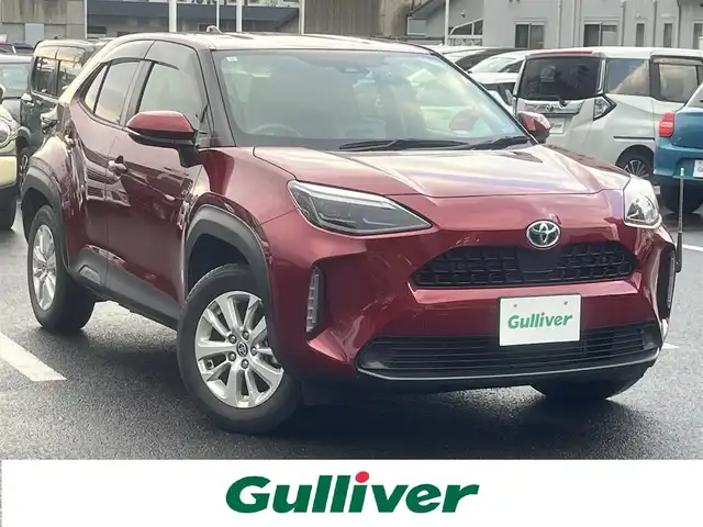 トヨタ ヤリスクロス ハイブリッド G 島根県 2021(令3)年 5.8万km センシュアルレッドマイカ 4WD/純正メモリナビ　/(AM/FM/フルセグTV/Ｂｌｕｅｔｏｏｔｈ接続)/前後ドライブレコーダー　/ビルトインＥＴＣ　/バックカメラ/クルーズコントロール　/ブラインドスポットモニター/前後コーナーセンサー　/レーンアシスト/プリクラッシュセーフティ　/パワーバックドア　/前席シートヒーター/ステアリングヒーター/電動パーキングブレーキ/オートホールド　/オートハイビーム／ライト　/純正16インチアルミホイール/純正フロアマット/スペアキー1本