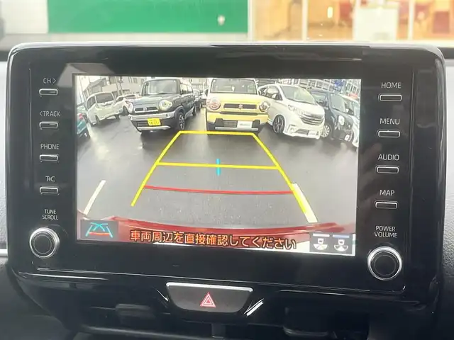 トヨタ ヤリスクロス ハイブリッド G 島根県 2021(令3)年 5.8万km センシュアルレッドマイカ 4WD/純正メモリナビ　/(AM/FM/フルセグTV/Ｂｌｕｅｔｏｏｔｈ接続)/前後ドライブレコーダー　/ビルトインＥＴＣ　/バックカメラ/クルーズコントロール　/ブラインドスポットモニター/前後コーナーセンサー　/レーンアシスト/プリクラッシュセーフティ　/パワーバックドア　/前席シートヒーター/ステアリングヒーター/電動パーキングブレーキ/オートホールド　/オートハイビーム／ライト　/純正16インチアルミホイール/純正フロアマット/スペアキー1本