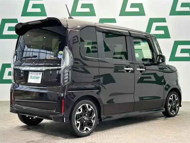 ホンダ Ｎ ＢＯＸ カスタム G L ターボ ホンダセンシング 鹿児島県 2018(平30)年 6.9万km プレミアムベルベットパープル・パール ホンダセンシング/・衝突軽減ブレーキ/・誤発進抑制機能（前後）/・歩行者事故低減ステアリング/・路外逸脱抑制機能/・アダプティブクルーズコントロール/・車線維持支援システム/・オートハイビーム/・先行車発進お知らせ機能/・標識認識機能/純正8インチSDナビ【VXU-185NBi】/（CD/DVD/フルセグ/Bluetooth/SD/USB）/バックカメラ/ビルトインETC/社外前方ドライブレコーダー【HDR-751G】/両側パワースライドドア/革巻きステアリング/ステアリングリモコン/パドルシフト/ハーフレザーシート/チップアップシート/電動格納ミラー/純正LEDヘッドライト/フロントフォグランプ/オートライト/シーケンシャルウィンカー/後席サンシェード/純正フロアマット＋ラバーマット/純正15インチアルミ/純正ドアバイザー