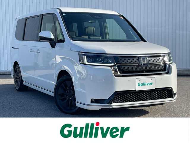 ホンダ ステップワゴン スパーダ eHEV 滋賀県 2024(令6)年 0.5万km プラチナホワイトパール ホンダセンシング/・衝突軽減ブレーキ/・誤発信抑制機能/・車線逸脱警報/・標識認識システム/・先行車発信通知/・アダプティブクルーズコントロール/・オートマチックハイビーム/・ブラインドスポットモニター/純正メモリナビ/(・フルセグTV CD DVD Bluetooth USB)/バックカメラ/両側パワースライドドア/パワーバックドア/ハーフレザーシート/シートヒーター/2列目オットマン/電動パーキングブレーキ/オートブレーキホールド/電動格納ミラー/ウインカーミラー/純正フロアマット/ETC/スマートキー×２/LEDヘッドライト/オートライト