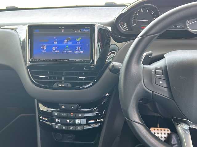 プジョー ２０８ シエロ 愛知県 2014(平26)年 5.4万km 赤 スカイルーフ/ECLIPSE製メモリーナビゲーション/フルセグTV・AM・FM・Bluetooth・AUX・CD・DVD/バックカメラ/ハーフレザーシート（黒）/前方ドライブレコーダー/本革巻きステアリング/クルーズコントロール/コーナーセンサー/ETC/オートライト/パドルシフト/フォグランプ/アームレスト/電動格納ミラー/ISOFIX/取扱説明書/点検整備記録簿あり(H27/H28/H29/R1/R3/R5)/保証書/スペアキー