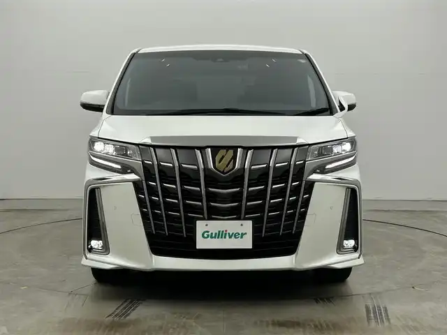 トヨタ アルファード S タイプゴールドⅡ 岡山県 2022(令4)年 1.4万km ホワイトパールクリスタルシャイン 9インチディスプレイオーディオ/・FM/AM/Bluetooth/フルセグ/CD/DVD/CarPlay/バックカメラ/12.1インチフリップダウンモニター/パワーバックドア/両側パワースライドドア/100V充電/ドライブレコーダー/ビルトインETC2.0/トヨタセーフティーセンス/・プリクラッシュセーフティ/・レーントレーシングアシスト/・レーダークルーズコントロール/・アダプティブハイビームシステム/・コーナーセンサー/オートブレーキホールド/MTモード付シフト/ダブルエアコン/純正18インチアルミ/純正フロアマット