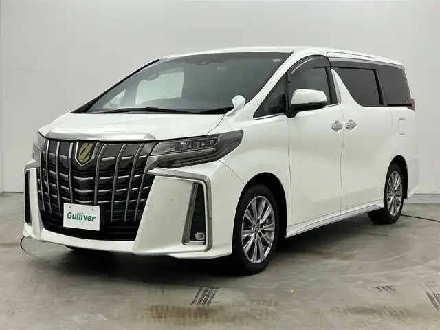 トヨタ アルファード S タイプゴールドⅡ 岡山県 2022(令4)年 1.4万km ホワイトパールクリスタルシャイン 9インチディスプレイオーディオ/・FM/AM/Bluetooth/フルセグ/CD/DVD/CarPlay/バックカメラ/12.1インチフリップダウンモニター/パワーバックドア/両側パワースライドドア/100V充電/ドライブレコーダー/ビルトインETC2.0/トヨタセーフティーセンス/・プリクラッシュセーフティ/・レーントレーシングアシスト/・レーダークルーズコントロール/・アダプティブハイビームシステム/・コーナーセンサー/オートブレーキホールド/MTモード付シフト/ダブルエアコン/純正18インチアルミ/純正フロアマット