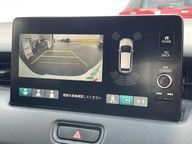 ホンダ ヴェゼル ハイブリッド e:HEV Z 佐賀県 2021(令3)年 6.7万km プラチナホワイトパール ワンオーナー/純正9インチナビゲーション・フルセグ/Bluetooth・USB・Applecarplay・androidaudio/バックカメラ/ビルトイン2.0ETC/パワーバックドア/置くだけ充電/AUTOHOLD/電子パーキング/ハーフレザーシート/シートヒーター/フルフラットシート/チップアップシート/革巻きステアリング/ステアリングヒーター/ステアリングリモコン/純正LEDシーケンシャルウィンカー/純正LEDヘッドライト/純正18インチアルミホイール/純正フロアマット/純正ドアバイザー/ホンダセンシング/・衝突軽減ブレーキ/・誤発進抑制機能/・歩行者事故低減ステアリング/・アダプティブクルーズコントロール/・路外逸脱抑制機能/・標識認識機能/・先行車発進お知らせ機能/・ブラインドスポットインフォメーション/・パーキングセンサーシステム/・緊急時停車支援機能