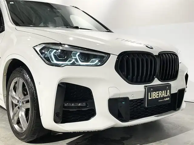 ＢＭＷ Ｘ１ xDrive 18d Mスポーツ EDジョイ+ 道央・札幌 2021(令3)年 3.5万km アルピンホワイトⅢ ドライビングアシストプラス/・ACC/アクティブクルーズコントロール/ドライビングアシスト/・レーンディパーチャーウォーニング/・前車接近警告機能/・衝突回避 被害軽減ブレーキ/パーキングアシスト/・PDC/パークディスタンスコントロール/・パーキングアシスト(縦列)/・リアビューカメラ/コンフォートパッケージ/・スライディングリヤシート/・ワイヤレスチャージング/・Mシートベルト/Mエアロダイナミクスパッケージ/Mスポーツサスペンション/コンフォートアクセス/オートマチックテールゲートオペレーション/LEDヘッドライト/LEDフロントフォグランプ/アンビエントライト/自動防眩ルームミラー/電動フロントシート/スポーツシート(ハーフレザーシート)/Mスポーツレザーステアリングホイール/10.25インチワイドコントロールディスプレイ/ミラー一体型ETC/社外ドライブレコーダー
