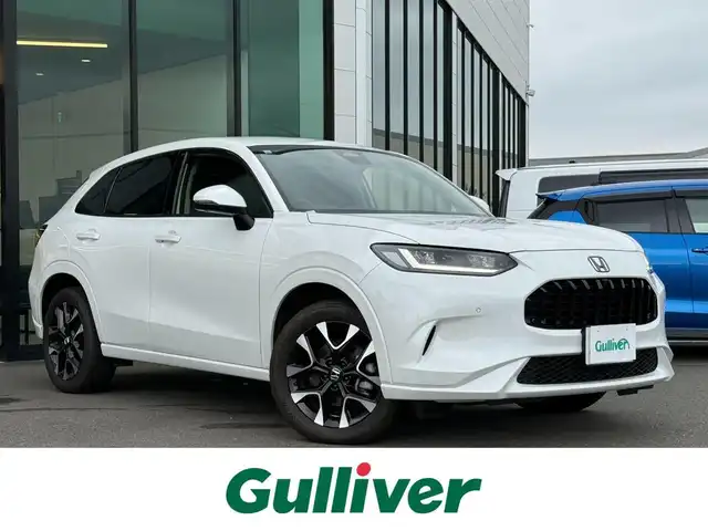 ホンダ ＺＲ－Ｖ ハイブリッド e:HEV Z 東京都 2023(令5)年 1.9万km プラチナホワイトパール BOSEサウンド/Honda SENSING/・衝突軽減ブレーキ/・誤発進抑制機能/・標識認識機能/・路外逸脱抑制機能/・車線維持支援システム/・先行車発進お知らせ機能/・アダプティブクルーズコントロール/・コーナーセンサー/マルチビューカメラシステム/プッシュスタート/純正9インチナビ/【FM/AM/USB/BT/フルセグTV】/ETC2.0/ワイヤレス充電器/レザーシート/パワーシート/シートヒーター/ステアリングヒーター/パワーテールゲート/LEDヘッドライト/オートライト/18インチ純正アルミホイール/スペアキー×１