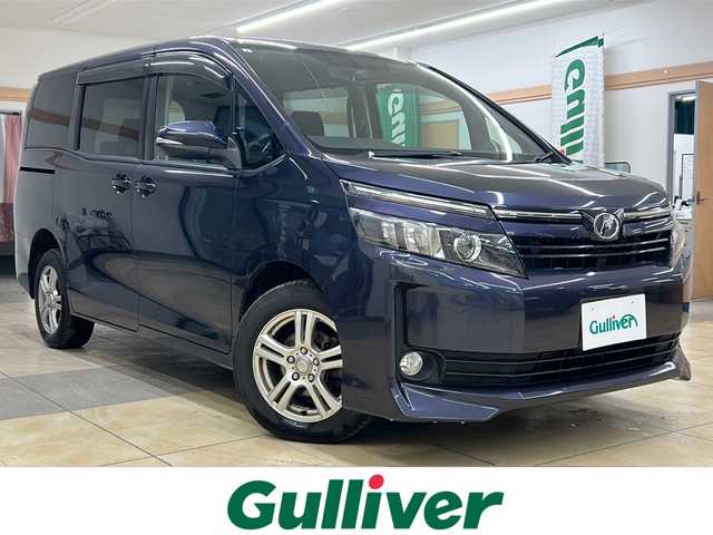 トヨタ ヴォクシー V 道央・札幌 2014(平26)年 10.9万km ダークバイオレットマイカメタリック ・4WD/・社外ナビ/フルセグTV/DVD/CD/SD/BT/・バックカメラ/・左側パワースライドドア/・社外エンジンスターター/・クルーズコントロール/・オートマチックハイビーム/・アイドリングストップ/・ETC/・横滑り防止/・リヤクーラー/・LEDヘッドライト/・フロントフォグ/・プッシュスタート/・スマートキー/・ドアバイザー/・電格ミラー