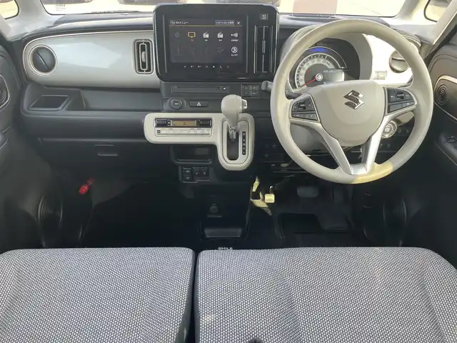 スズキ ワゴンＲ スマイル HYBRID X 岡山県 2025(令7)年 0.2万km シフォンアイボリーメタリック 登録時走行距離：　1930km/禁煙車/カラーヘッドアップディスプレイ/純正9インチナビ/　(CD/フルセグTV/Bluetooth)/全方位カメラ/クルーズコントロール(追従走行あり)/衝突被害軽減システム/後退時ブレーキサポート/コーナーセンサー/標識認識機能/両側パワースライドドア/シートヒーター/ステアリングスイッチ/純正LEDヘッドライト/フォグライト/オートライト/プッシュスタート/スマートキー/アイドリングストップ/ウインカーミラー/電動格納ミラー/純正フロアマット/横滑防止装置/盗難防止装置/取扱説明書/新車時整備手帳（保証書）