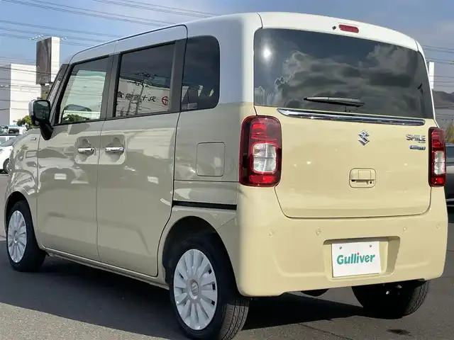 スズキ ワゴンＲ スマイル HYBRID X 岡山県 2025(令7)年 0.2万km シフォンアイボリーメタリック 登録時走行距離：　1930km/禁煙車/カラーヘッドアップディスプレイ/純正9インチナビ/　(CD/フルセグTV/Bluetooth)/全方位カメラ/クルーズコントロール(追従走行あり)/衝突被害軽減システム/後退時ブレーキサポート/コーナーセンサー/標識認識機能/両側パワースライドドア/シートヒーター/ステアリングスイッチ/純正LEDヘッドライト/フォグライト/オートライト/プッシュスタート/スマートキー/アイドリングストップ/ウインカーミラー/電動格納ミラー/純正フロアマット/横滑防止装置/盗難防止装置/取扱説明書/新車時整備手帳（保証書）