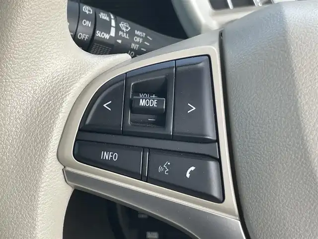 スズキ ワゴンＲ スマイル HYBRID X 岡山県 2025(令7)年 0.2万km シフォンアイボリーメタリック 登録時走行距離：　1930km/禁煙車/カラーヘッドアップディスプレイ/純正9インチナビ/　(CD/フルセグTV/Bluetooth)/全方位カメラ/クルーズコントロール(追従走行あり)/衝突被害軽減システム/後退時ブレーキサポート/コーナーセンサー/標識認識機能/両側パワースライドドア/シートヒーター/ステアリングスイッチ/純正LEDヘッドライト/フォグライト/オートライト/プッシュスタート/スマートキー/アイドリングストップ/ウインカーミラー/電動格納ミラー/純正フロアマット/横滑防止装置/盗難防止装置/取扱説明書/新車時整備手帳（保証書）