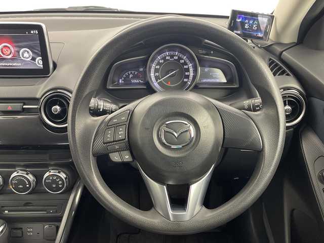 マツダ デミオ 13S 大分県 2015(平27)年 5.1万km ディープクリスタルブルーマイカ 純正ナビ/TV/（CD/DVD/USB/AUX/BT）/スマートシティブレーキサポート/誤発進抑制機能/LEDヘッドライト/オートライト/MTモード付AT/アイドリングストップ/ステアリングリモコン/ドライブレコーダー/ビルトインETC/プッシュスタート/スマートキー