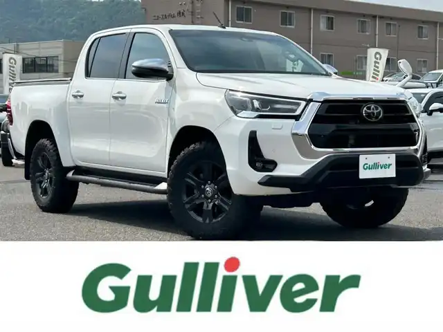 トヨタ ハイラックス Z 広島県 2021(令3)年 4.8万km スーパーホワイトⅡ ワンオーナー/アルパインフローティングナビ/[BT/CD/USB/SD]/バックカメラ/レーダークルーズコントロール/衝突軽減ブレーキ装置/車線逸脱警報/パワーヒート/ダウンヒルアシストコントロール/社外マフラー[SUXON]/クリアランスソナー/トノカバー/マッドガード/プッシュスタート/スペアキー「スマートキー」/ETC/保証書/取扱説明書
