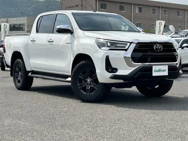 トヨタ ハイラックス Z 広島県 2021(令3)年 4.8万km スーパーホワイトⅡ ワンオーナー/アルパインフローティングナビ/[BT/CD/USB/SD]/バックカメラ/レーダークルーズコントロール/衝突軽減ブレーキ装置/車線逸脱警報/パワーヒート/ダウンヒルアシストコントロール/社外マフラー[SUXON]/クリアランスソナー/トノカバー/マッドガード/プッシュスタート/スペアキー「スマートキー」/ETC/保証書/取扱説明書