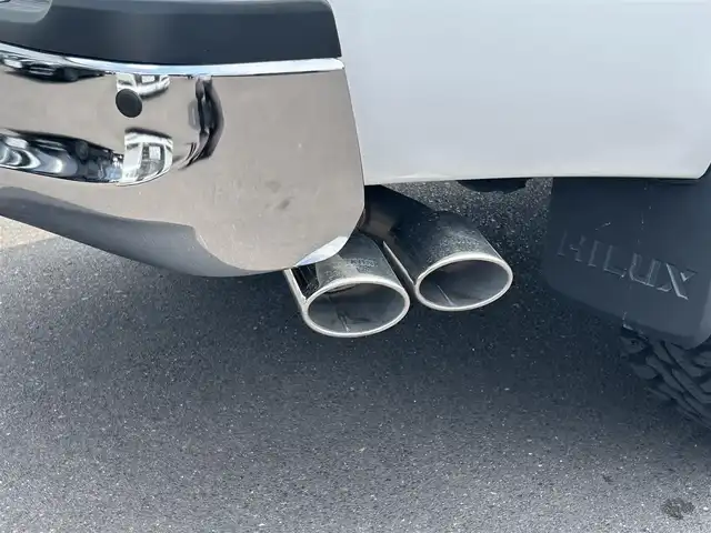 トヨタ ハイラックス Z 広島県 2021(令3)年 4.8万km スーパーホワイトⅡ ワンオーナー/アルパインフローティングナビ/[BT/CD/USB/SD]/バックカメラ/レーダークルーズコントロール/衝突軽減ブレーキ装置/車線逸脱警報/パワーヒート/ダウンヒルアシストコントロール/社外マフラー[SUXON]/クリアランスソナー/トノカバー/マッドガード/プッシュスタート/スペアキー「スマートキー」/ETC/保証書/取扱説明書
