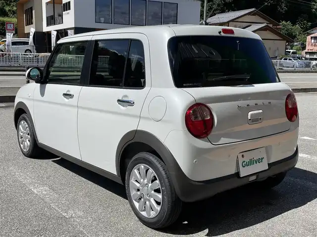 スズキ ラパン X 岐阜県 2024(令6)年 0.2万km ピュアホワイトP ワンオーナー/4WD/純正ディスプレイオーディオ/【Bluetooth．AM/FMラジオ】/バックカメラ/スマートキー/ETC/ドライブレコーダー/ベンチシート/シートヒーター/純正フロアマット/純正アルミホイール/コーナーセンサー/オートライト/横滑り防止装置/レーンキープアシスト/衝突被害軽減ブレーキ/盗難防止装置/保証書/取扱説明書
