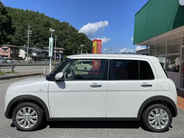 スズキ ラパン X 岐阜県 2024(令6)年 0.2万km ピュアホワイトP ワンオーナー/4WD/純正ディスプレイオーディオ/【Bluetooth．AM/FMラジオ】/バックカメラ/スマートキー/ETC/ドライブレコーダー/ベンチシート/シートヒーター/純正フロアマット/純正アルミホイール/コーナーセンサー/オートライト/横滑り防止装置/レーンキープアシスト/衝突被害軽減ブレーキ/盗難防止装置/保証書/取扱説明書