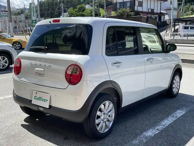 スズキ ラパン X 岐阜県 2024(令6)年 0.2万km ピュアホワイトP ワンオーナー/4WD/純正ディスプレイオーディオ/【Bluetooth．AM/FMラジオ】/バックカメラ/スマートキー/ETC/ドライブレコーダー/ベンチシート/シートヒーター/純正フロアマット/純正アルミホイール/コーナーセンサー/オートライト/横滑り防止装置/レーンキープアシスト/衝突被害軽減ブレーキ/盗難防止装置/保証書/取扱説明書