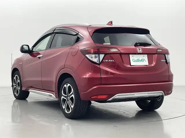 ホンダ ヴェゼル ハイブリッド Z ホンダセンシング 熊本県 2016(平28)年 4.8万km プレミアムクリスタルレッドM モデューロエアロ　/純正8インチナビ　/前後ドライブレコーダー　/バックカメラ　/ビルトインＥＴＣ　/前席シートヒーター　/ホンダセンシング/・衝突軽減ブレーキ/・レーンキープアシスト/・アダブティブクルーズコントロール/・先行車発進お知らせ機能/・路外逸脱抑制機能/・レーンキープアシスト/・標識認識システム/・オートハイビーム/横滑り防止/ハーフレザーシート/コーナーポール/電動パーキングサポート/ブレーキホールド/ジャズブラウン内装/純正フロアマット/純正17インチAW/オートライト/LEDヘッドライト/スマートキー/プッシュスタート/スペアキー1本