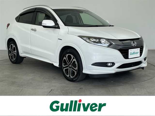 ホンダ ヴェゼル ハイブリッド Z 大分県 2016(平28)年 9.3万km ホワイトオーキッドパール 純正ナビ/シートヒーター/純正アルミホイル17インチ/純正フロアマット/ルーフレール/オートブレーキホールド/HDMI入力端子/USB入力端子/革巻ステアリング/ハーフレザー/スペアキー/バックカメラ