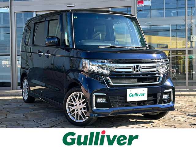 ホンダ Ｎ ＢＯＸ カスタム L ターボ 静岡県 2023(令5)年 3万km ミッドナイトブルービームM 【安全装備】/ホンダセンシング/アダプティブ・クルーズ・コントロール（ACC）/・作動車速域：約30km/hから100km/h間/車線維持支援システム（LKAS）/・作動車速：約65km/hから100km/h間/・ステアリング制御/衝突軽減ブレーキ（CMBS）/・歩行者検知機能/・作動車速：約80km/h未満時/・対向車車速：約30km/hから80km/h時/誤発進抑制機能（前進）/・ミリ波レーダー検知：作動車速10km/h未満/歩行者事故低減ステアリング/・作動車速10km/hから40km/h間/路外逸脱抑制機能/・作動車速：約60km/hから100km/h間/先行車発進お知らせ機能/標識認識機能/オートハイビーム/誤発進抑制機能（後進）・ソナー検知：作動車速10km/h未満 /【主要装備】/・純正ナビ　/・フルセグテレビ　/・前後ドライブレコーダー　/・両側パワースライドドア　/・パーキングセンサー　/・ＬＥＤヘッドライト　/・ＥＴＣ　/・ステアリングスイッチ　/・ハーフレザーシート　/・シートヒーター