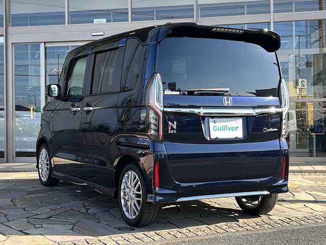 ホンダ Ｎ ＢＯＸ カスタム L ターボ 静岡県 2023(令5)年 3万km ミッドナイトブルービームM 【安全装備】/ホンダセンシング/アダプティブ・クルーズ・コントロール（ACC）/・作動車速域：約30km/hから100km/h間/車線維持支援システム（LKAS）/・作動車速：約65km/hから100km/h間/・ステアリング制御/衝突軽減ブレーキ（CMBS）/・歩行者検知機能/・作動車速：約80km/h未満時/・対向車車速：約30km/hから80km/h時/誤発進抑制機能（前進）/・ミリ波レーダー検知：作動車速10km/h未満/歩行者事故低減ステアリング/・作動車速10km/hから40km/h間/路外逸脱抑制機能/・作動車速：約60km/hから100km/h間/先行車発進お知らせ機能/標識認識機能/オートハイビーム/誤発進抑制機能（後進）・ソナー検知：作動車速10km/h未満 /【主要装備】/・純正ナビ　/・フルセグテレビ　/・前後ドライブレコーダー　/・両側パワースライドドア　/・パーキングセンサー　/・ＬＥＤヘッドライト　/・ＥＴＣ　/・ステアリングスイッチ　/・ハーフレザーシート　/・シートヒーター