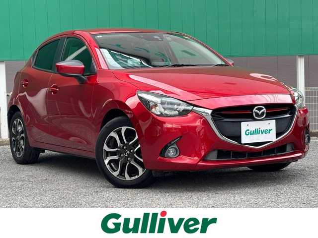 マツダ デミオ XD ツーリング 千葉県 2014(平26)年 7.8万km ソウルレッドプレミアムメタリック 純正ナビ/ヘッドアップディスプレイ/ディーゼルターボ/バックカメラ/ＥＴＣ/パドルシフト/チルトステアリング/クルーズコントロール/ステアリングスイッチ　/横揺れ防止装置/衝突軽減ブレーキ/純正アルミホイール/オートライト/地図SDあり