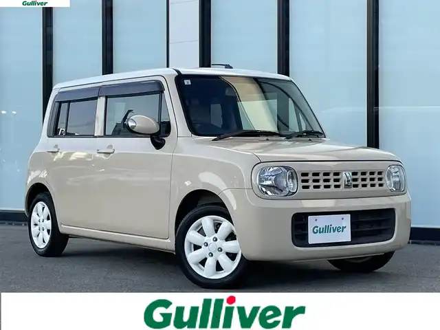 スズキ ラパン X 大阪府 2013(平25)年 5.3万km ベージュ 社外ナビ /・フルセグTV Bluetooth CD/DVD/バックカメラ /ETC  /アイドリングストップ /純正フロアマット /プッシュスタート /スマートキー /純正14インチスチール /ハロゲンヘッドライト/取説・保証書/スマートキー