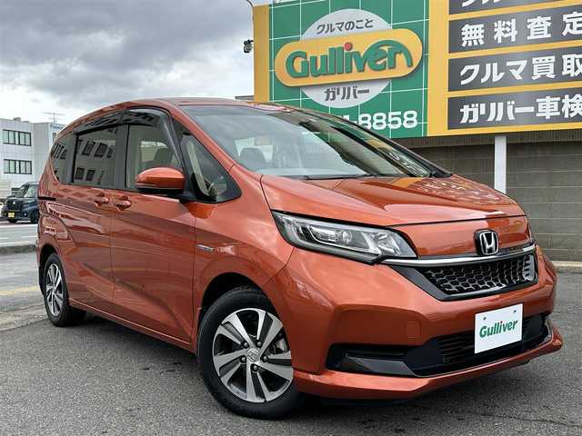 ホンダ フリード ハイブリット G ホンダセンシング 三重県 2021(令3)年 4.8万km プレミアムクリスタルオレンジM ホンダセンシング/純正ナビ/　・フルセグＴＶ/　・Bluetooth/　・ＤＶＤ再生/　・ＵＳＢ/　・録音/バックガイドカメラ/アダプティブクルーズコントロール/両側パワースライドドア/スマートキーｘ２/プッシュスタート/ハーフレザーシート/D/N席シートヒーター/ＬＥＤヘッドライト/ドライブレコーダー（前後）/ステアリングスイッチ/オートリトラクタブルミラー/ターンミラー/純正フロアマット/プライバシーガラス/横滑り防止機能