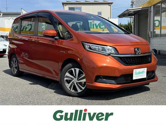 ホンダ フリード ハイブリット G ホンダセンシング 三重県 2021(令3)年 4.8万km プレミアムクリスタルオレンジM ホンダセンシング/純正ナビ/　・フルセグＴＶ/　・Bluetooth/　・ＤＶＤ再生/　・ＵＳＢ/　・録音/バックガイドカメラ/アダプティブクルーズコントロール/両側パワースライドドア/スマートキーｘ２/プッシュスタート/ハーフレザーシート/D/N席シートヒーター/ＬＥＤヘッドライト/ドライブレコーダー（前後）/ステアリングスイッチ/オートリトラクタブルミラー/ターンミラー/純正フロアマット/プライバシーガラス/横滑り防止機能