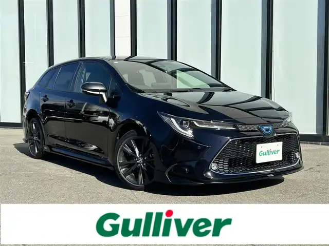 トヨタ カローラツーリング ハイブリッド ダブルバイビー 大阪府 2021(令3)年 4.7万km スパークリングブラックパールクリスタルシャイン トヨタセーフティセンス/・アダプティクブクルーズコントロール/・プリクラッシュセーフティー/・レーントレーシングアシスト/・クリアランスソナー/・オートマチックハイビーム/・ロードサインアシスト/純正9インチナビ/・Bluetooth/CD/DVD/AppleCarPlay/ラジオ/　Miracast/AndroidAuto/主要装備/・バックカメラ/・ブラインドスポットモニター/・ヘッドアップディスプレイ/・オートホールド/・ステアリングヒーター/・ステアリングリモコン/・TOMSエアロ（フロント・サイド・リアアンダー・マフラー有）/・ドライブレコーダー/・ETC2.0