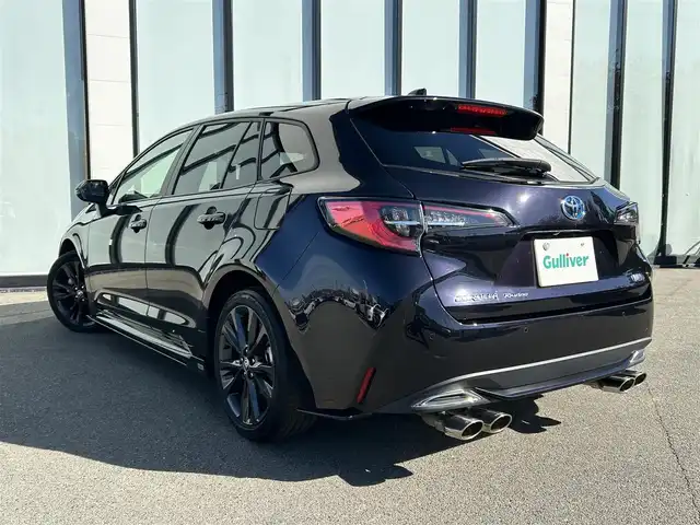 トヨタ カローラツーリング ハイブリッド ダブルバイビー 大阪府 2021(令3)年 4.7万km スパークリングブラックパールクリスタルシャイン トヨタセーフティセンス/・アダプティクブクルーズコントロール/・プリクラッシュセーフティー/・レーントレーシングアシスト/・クリアランスソナー/・オートマチックハイビーム/・ロードサインアシスト/純正9インチナビ/・Bluetooth/CD/DVD/AppleCarPlay/ラジオ/　Miracast/AndroidAuto/主要装備/・バックカメラ/・ブラインドスポットモニター/・ヘッドアップディスプレイ/・オートホールド/・ステアリングヒーター/・ステアリングリモコン/・TOMSエアロ（フロント・サイド・リアアンダー・マフラー有）/・ドライブレコーダー/・ETC2.0