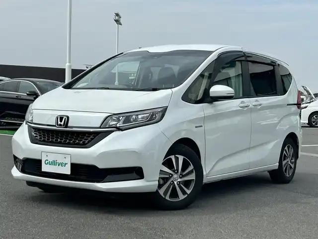 ホンダ フリード ハイブリット G ホンダセンシング 奈良県 2020(令2)年 3.4万km プラチナホワイトパール 純正ナビ　/フルセグテレビ　/ｂｌｕｅｔｏｏｔｈ　/バックカメラ　/ＨＤＭＩ　/ビルトインＥＴＣ　/ホンダセンシング　/両側パワースライドア　/純正ドライブレコーダー前後　/シートヒーター　/ハーフレザーシート/スペアキー