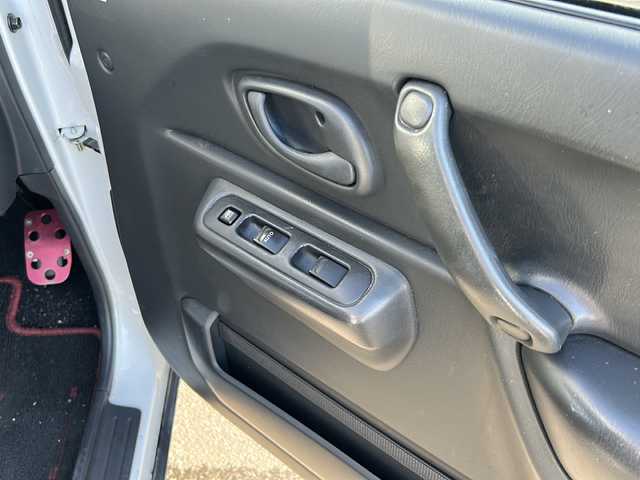 スズキ ジムニー XG 佐賀県 2014(平26)年 6.4万km スペリアホワイト 社外ナビ(AVIC-ZH0007)/Bluetooth/CD/DVD/フルセグTV/車高調/バックモニター/4WD/ETC/社外フロアマット/布系シート/ハロゲンヘッドライト/エアコン/社外アルミホイール/リモコンキー/保証書/取扱説明書/点検記録簿(R3/4/6)