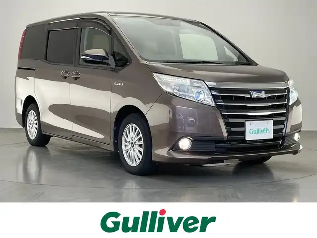 トヨタ ノア ハイブリッド G 愛知県 2015(平27)年 7.9万km ダークシェリーマイカM 純正９型ナビ　純正後席モニター　両側パワスラ　禁煙車　ワイヤレス充電　フルセグＴＶ　バックカメラ　ＥＴＣ　クルコン　シートヒーター　ＬＥＤオートライト　フォグ　ｎａｎｏｅ　プッシュスタート　純正マット