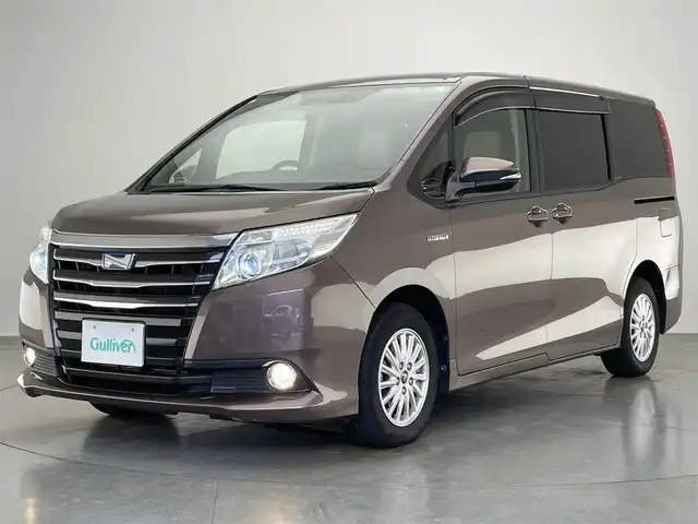 トヨタ ノア ハイブリッド G 愛知県 2015(平27)年 7.9万km ダークシェリーマイカM 純正９型ナビ　純正後席モニター　両側パワスラ　禁煙車　ワイヤレス充電　フルセグＴＶ　バックカメラ　ＥＴＣ　クルコン　シートヒーター　ＬＥＤオートライト　フォグ　ｎａｎｏｅ　プッシュスタート　純正マット