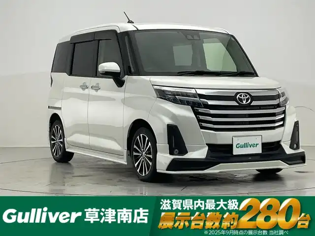 トヨタ ルーミー カスタムG－T 滋賀県 2020(令2)年 2.4万km パールホワイトⅢ TRDエアロ/純正9インチナビ/【Bluetooth/CD/DVD/フルセグTV】/バックカメラ/ETC/ワイヤレス充電/シートヒーター/両側パワースライドドア/追従クルーズコントロール/レーンキープアシスト/LEDライト/電動パーキングブレーキ/オートホールド/アイドリングストップ/ステアリングスイッチ/電動格納ミラー/スマートキー