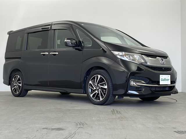 ホンダ ステップワゴン スパーダ クルスピセンシング 鹿児島県 2016(平28)年 5.4万km プレミアムスパークルブラックパール 純正ナビ/　(CD/DVD/USB/HDMI/Bluetooth)/フルセグTV/マルチビューカメラ/純正フリップダウンモニター/純正ドライブレコーダー/ステアリングスイッチ/パドルシフト/アダプティブクルーズコントロール/ホンダセンシング/　・衝突軽減ブレーキ/　・路外逸脱抑制システム/　・標識認識機能/アイドリングストップ/プッシュエンジンスタート/スマートキー×2/両側パワースライドドア/ハーフレザー調シート/前席シートヒーター/リア席サイドサンシェード/純正フロアマット/わくわくゲート/ドアバイザー/LEDヘッドライト/フォグランプ/オートライト/ウィンカー付き電動格納ミラー/取扱説明書/ナビ取扱説明書